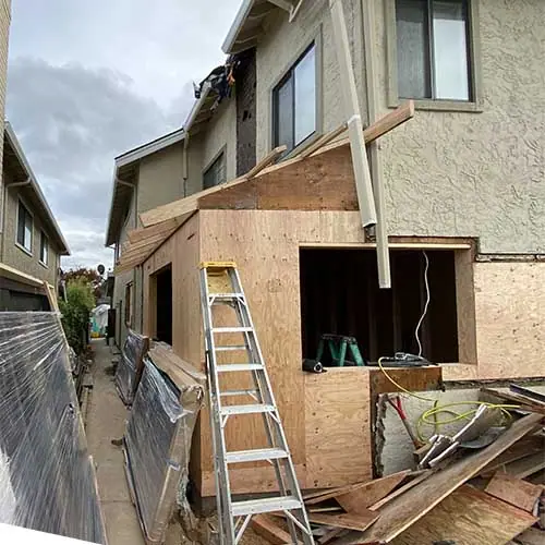Addition framing tied into an existing two-story Bay Area home