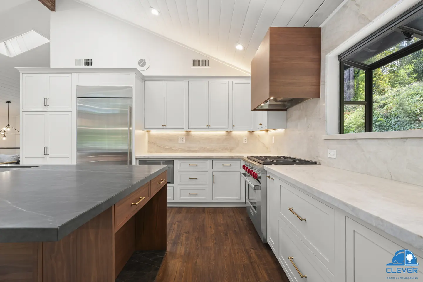 Kitchen view along the walnut island to the range, hood and built-in refrigerator, kitchen and bath remodel in Los Gatos, CA