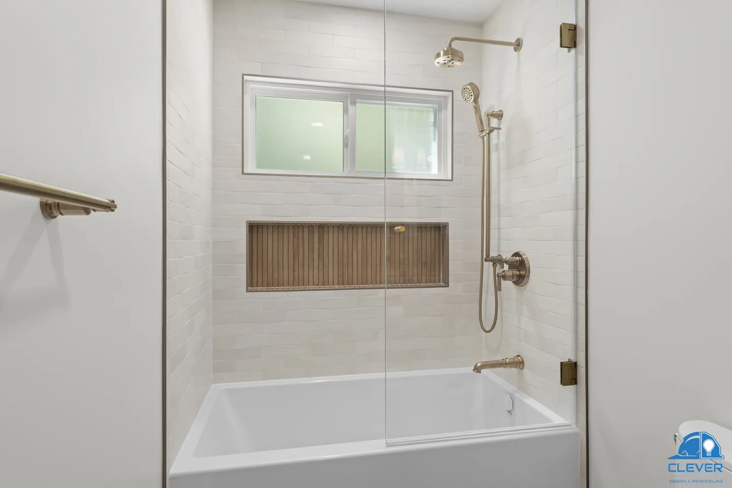 Tub-shower with a glass panel, a long wood-look tile niche and brass fixtures, kitchen and bath remodel in Los Gatos, CA